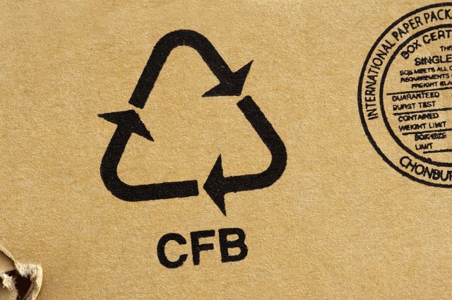 A recycling symbol on a cardboard box
