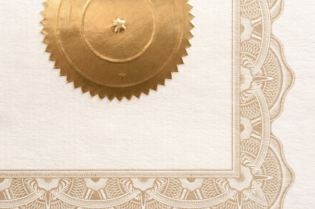 a certificate border and gold stamp sticker