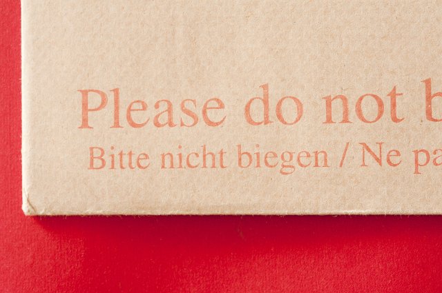 paper surfaces of an envelope and do not bend label