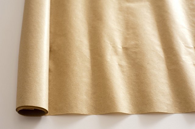 an unrolled piece of brown packaging paper