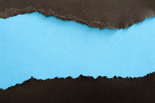 torn blue and black paper background