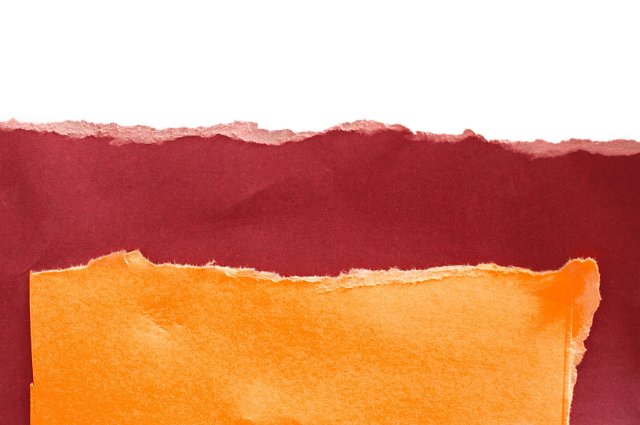 contrasting pieces of torn coloured heavyweight art paper