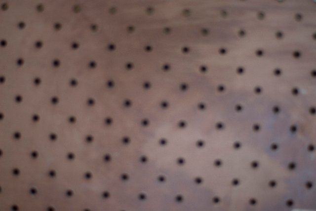 defocused abstract blurred texture of pegboard