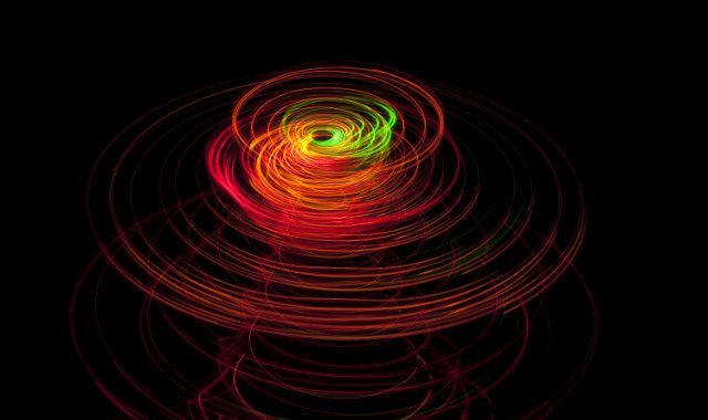 a spinning top effect created by a long exposure image of moving lights