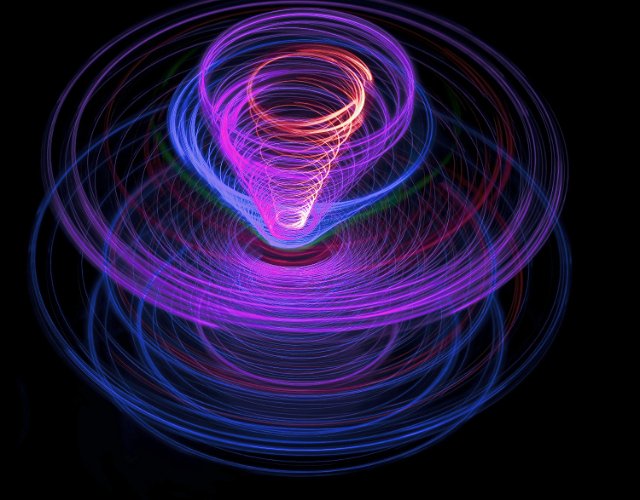 a spinning effect images for purple, blue and red light purple light